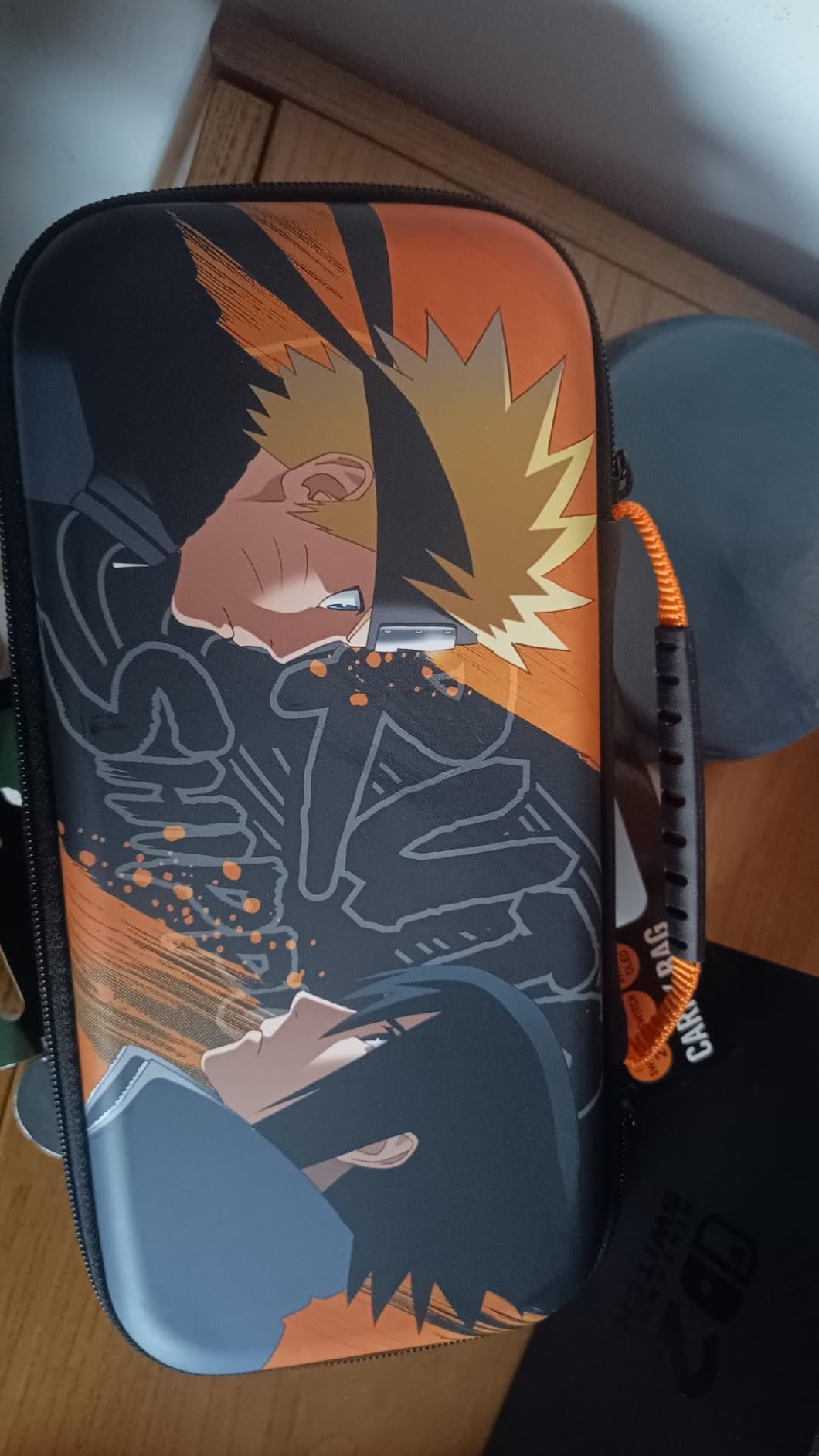 Konix Naruto Shippuden custodia Switch 2 nero arancione 8 giochi
